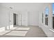 Bright bedroom featuring neutral carpet, double windows, and closet at 1279 Kindness Nw Ct, Concord, NC 28027