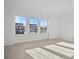 Bright bedroom with large windows offering neighborhood views and neutral carpet at 1279 Kindness Nw Ct, Concord, NC 28027