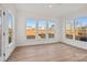 Bright bedroom with large windows offering neighborhood views and wood flooring at 1279 Kindness Nw Ct, Concord, NC 28027