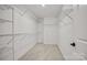 Walk-in closet with white wire shelving and carpeted floor at 1279 Kindness Nw Ct, Concord, NC 28027
