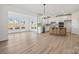 Modern kitchen with white cabinets, stainless steel appliances, and a stylish center island at 1279 Kindness Nw Ct, Concord, NC 28027