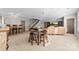 Spacious basement with a bar area, stairs to the upper level, and comfortable seating at 12860 Westmoreland Farm Rd, Davidson, NC 28036