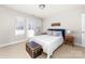 Inviting bedroom featuring neutral carpet, a white comforter, and a convenient door to the outdoors at 12860 Westmoreland Farm Rd, Davidson, NC 28036