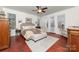 Cozy bedroom with natural light, a ceiling fan, and neutral tones for a relaxing atmosphere at 12860 Westmoreland Farm Rd, Davidson, NC 28036