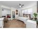 Tranquil bedroom featuring a ceiling fan, a comfortable bed, and tasteful decorative touches at 12860 Westmoreland Farm Rd, Davidson, NC 28036