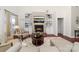 Comfortable living room showcasing built-in shelving, fireplace, and plush seating at 12860 Westmoreland Farm Rd, Davidson, NC 28036