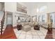 Bright living room with soaring ceilings, hardwood floors, and comfortable seating area at 12860 Westmoreland Farm Rd, Davidson, NC 28036