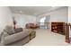 Cozy living room with neutral carpet, comfortable seating, and an open view to the lower level at 12860 Westmoreland Farm Rd, Davidson, NC 28036