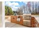 Outdoor kitchen featuring built-in grills and brick surround at 12860 Westmoreland Farm Rd, Davidson, NC 28036