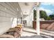 Covered outdoor kitchen boasts a stainless steel grill and brick surround at 12860 Westmoreland Farm Rd, Davidson, NC 28036