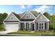 Charming single Gathering home with beautiful landscaping, two-car garage, and neutral color palette at 143 Glenn Dr, Mooresville, NC 28115