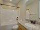 Bathroom with granite vanity, bronze fixtures, tiled bath and shower combination at 1538 Riverwalk Pkwy, Rock Hill, SC 29730
