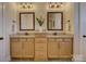 Bathroom featuring double sink vanity, framed mirrors, granite countertops, and tile flooring at 1538 Riverwalk Pkwy, Rock Hill, SC 29730