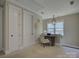 Bedroom with a study desk, a pendant light and two closets at 1538 Riverwalk Pkwy, Rock Hill, SC 29730