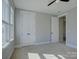 Bedroom featuring plush carpeting, a ceiling fan, and double door closet at 1538 Riverwalk Pkwy, Rock Hill, SC 29730