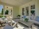 Inviting covered patio features stylish outdoor seating, a patterned rug, and elegant decor for relaxation at 1538 Riverwalk Pkwy, Rock Hill, SC 29730