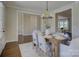 Dining room showcasing a rustic table, six chairs, and an open view to other living spaces at 1538 Riverwalk Pkwy, Rock Hill, SC 29730