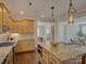 Spacious kitchen showcasing an island, granite countertops, stainless steel appliances, and open layout at 1538 Riverwalk Pkwy, Rock Hill, SC 29730