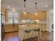 Charming kitchen featuring stainless appliances, an island, granite counters, and ample cabinet space at 1538 Riverwalk Pkwy, Rock Hill, SC 29730