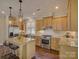 Bright kitchen featuring stainless steel appliances, granite countertops, and a central island with seating at 1538 Riverwalk Pkwy, Rock Hill, SC 29730