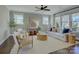 Bright living room with neutral tones, stylish furniture, and a large window overlooking the neighborhood at 1538 Riverwalk Pkwy, Rock Hill, SC 29730