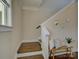 Staircase with wooden treads, white risers and decorative mirrors at 1538 Riverwalk Pkwy, Rock Hill, SC 29730