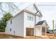 New construction home featuring white vinyl siding, attached one car garage and covered front porch at 160 S Sycamore St, Mooresville, NC 28115