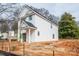 New construction home with vinyl siding, black trim windows, covered front entry and attached one car garage at 160 S Sycamore St, Mooresville, NC 28115