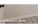 Close-up of a room featuring gray wood-look floors and white baseboard trim at 162 S Sycamore St, Mooresville, NC 28115