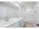 Modern bathroom featuring double sinks, white cabinets, and shower-tub combo at 162 S Sycamore St, Mooresville, NC 28115
