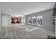 Open-concept living room flows into the kitchen with tile flooring, natural light, and an inviting layout at 1766 Canebrook Gln, York, SC 29745