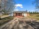 Exterior view of a home featuring a charming outdoor living space with a welcoming back porch at 2100 Lincolnton Hwy, Cherryville, NC 28021