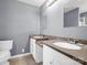 Bathroom with dual sinks, white cabinets, and modern fixtures at 2100 Lincolnton Hwy, Cherryville, NC 28021