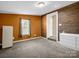 Comfortable bedroom featuring neutral carpet, a window and brick accents at 2100 Lincolnton Hwy, Cherryville, NC 28021