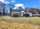 Charming brick home featuring a new roof, well-maintained landscaping, and a welcoming front entrance at 2100 Lincolnton Hwy, Cherryville, NC 28021