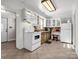 Functional kitchen with white cabinets, appliances, and a rustic island at 2100 Lincolnton Hwy, Cherryville, NC 28021