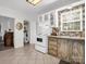 Open-concept kitchen with a view to the door and cabinets with glass fronts at 2100 Lincolnton Hwy, Cherryville, NC 28021