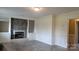 Open living room featuring a stone fireplace and beautiful herringbone floors at 2100 Lincolnton Hwy, Cherryville, NC 28021