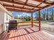 Cozy covered porch with a grill, perfect for outdoor cooking and entertaining with a view of the backyard at 2100 Lincolnton Hwy, Cherryville, NC 28021