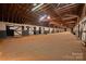 Spacious barn interior with horse stalls, providing a functional and well-maintained space for equestrian activities at 2137 Old Latter Rd, Newton, NC 28658