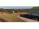 Exterior view of the barn with a fenced pasture, offering a picturesque setting for horses at 2137 Old Latter Rd, Newton, NC 28658