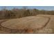 Aerial view of the riding ring, providing a clear view of the equestrian facilities and surrounding landscape at 2137 Old Latter Rd, Newton, NC 28658