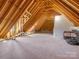 Spacious attic with exposed beams, a subfloor and potential for converting to bonus space at 2432 Westfield Rd, Charlotte, NC 28207
