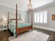 Charming bedroom with four-poster bed, neutral walls and cozy rug at 2432 Westfield Rd, Charlotte, NC 28207