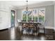 Dining room with dark wood floors and natural light and stylish chandelier, perfect for entertaining at 2432 Westfield Rd, Charlotte, NC 28207