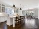 Open concept kitchen features a large island, pendant lighting and breakfast bar seating at 2432 Westfield Rd, Charlotte, NC 28207