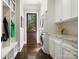 Well-organized laundry room with stacked washer/dryer, granite counters and custom cabinets at 2432 Westfield Rd, Charlotte, NC 28207