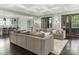Open living room features a coffered ceiling, wood floors, french doors, and flows into an open kitchen at 2432 Westfield Rd, Charlotte, NC 28207