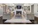 Bright living room with fireplace, built-ins, and elegant decor, creating a cozy and inviting space at 2432 Westfield Rd, Charlotte, NC 28207