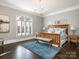 Serene main bedroom with hardwood floors, plantation shutters, and chandelier at 2432 Westfield Rd, Charlotte, NC 28207